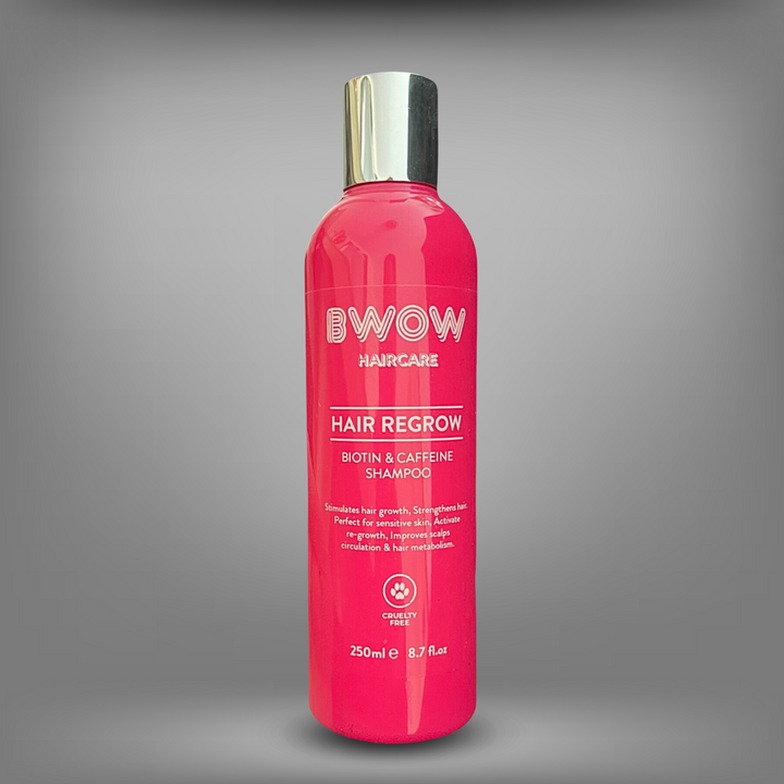 Pink bottle of BWOW Hair Regrow Biotin & Caffeine Shampoo with a silver cap, designed to stimulate hair growth and strengthen hair.